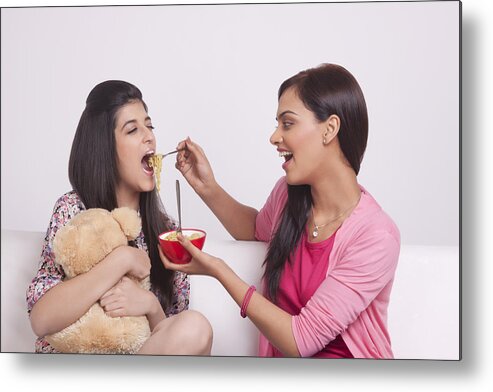 Sibling Metal Print featuring the photograph Two young women eating noodles by Sudipta Halder