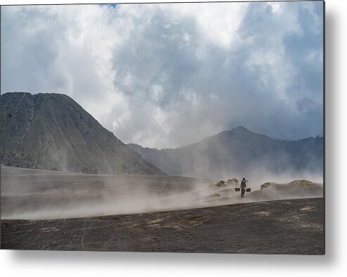 Tranquility Metal Print featuring the photograph Unidentified local people of Tengger walking in sandstorm at savanna of Tengger caldera, Mt. Bromo by Shaifulzamri