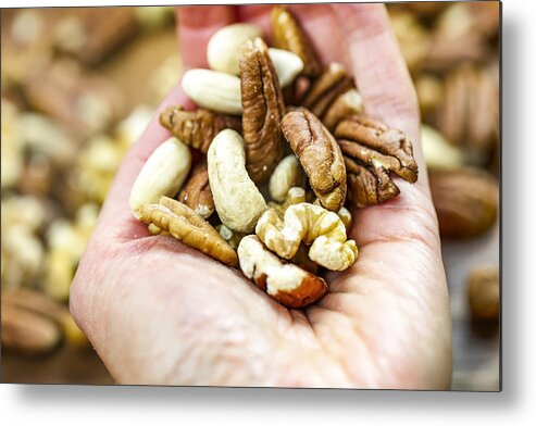 Nut Metal Print featuring the photograph Woman holding handful of fresh nuts. Mixed whole nuts. Nut Sources of Vitamin B9 Folate by Mikroman6