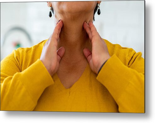 Care Metal Print featuring the photograph Woman with thyroid gland problem by Bymuratdeniz