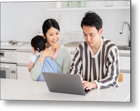 Internet Metal Print featuring the photograph Young Asian Family Using Laptop In Kitchen by Itakayuki