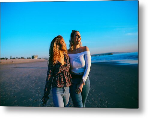 People Metal Print featuring the photograph young female friends enjoying the walk on the Venice beach in LA, California by Lechatnoir