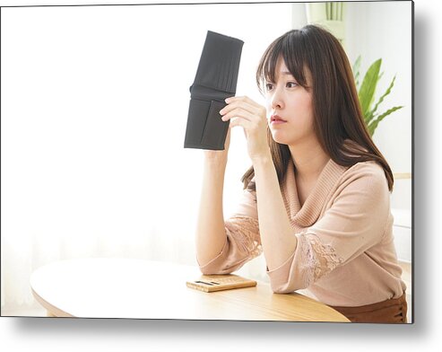 Debt Metal Print featuring the photograph Young woman figuring domestic accounts by Maroke