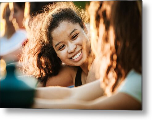 25-29 Years Metal Print featuring the photograph Young Woman Smiling While Out With Fitness Group by Hinterhaus Productions