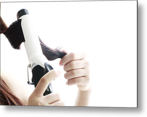 People Metal Print featuring the photograph Young Woman Using Curling Iron,close-up by RunPhoto