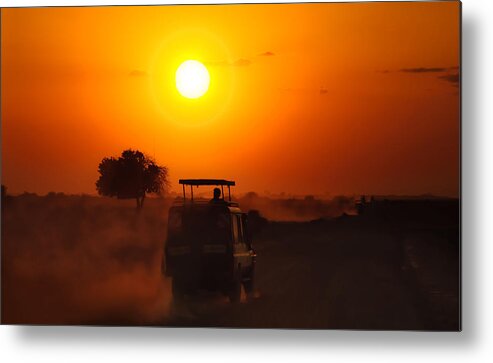Africa Metal Print featuring the photograph Driving Into a Glowing African Sunset by Mitchell R Grosky
