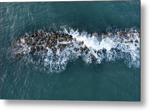Ocean Metal Print featuring the photograph Aerial view from a flying drone of blue sea water and break water. Sea wall coastline by Michalakis Ppalis