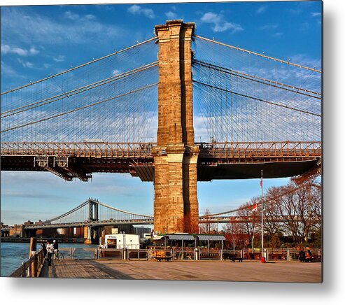 Amazing Brooklyn Bridge Photos Metal Print featuring the photograph New York Bridges Lit by Golden Sunset by Mitchell R Grosky