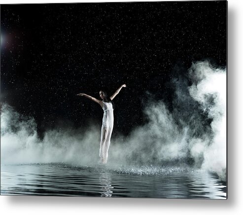 People Metal Print featuring the photograph Female In White Dancing, Rainy Night by Jonathan Knowles