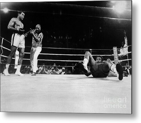 People Metal Print featuring the photograph Muhammad Ali Knocks George Foreman Onto by Bettmann