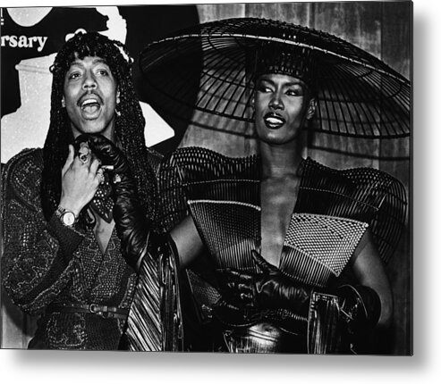 Singer Metal Print featuring the photograph Rick James And Grace Jones Attend by George Rose