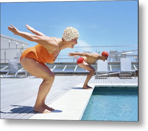 Diving Into Water Metal Print featuring the photograph Senior Couple Ready To Dive In To by Stockbyte