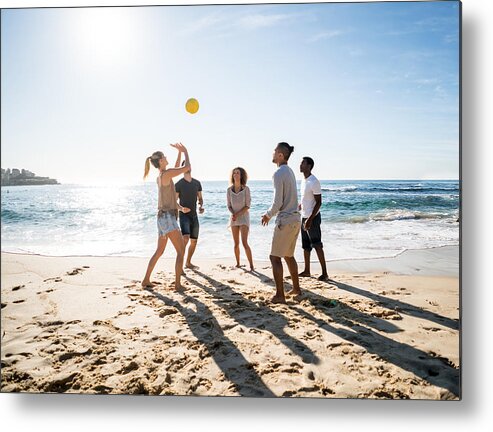 People Metal Print featuring the photograph Group of people playing beach volleyball by Andresr