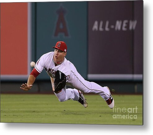 Yoenis Cespedes Metal Print featuring the photograph Yoenis Cespedes and Mike Trout by Jeff Gross