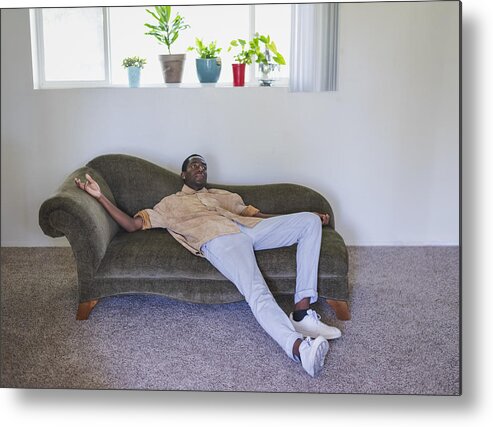 Handsome People Metal Print featuring the photograph Young man lounging on sofa by Tony Anderson