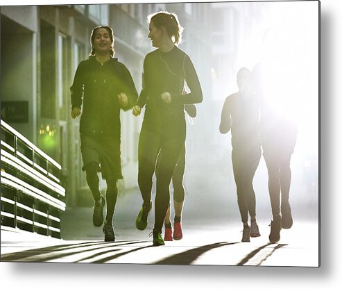 Young Men Metal Print featuring the photograph Small Group Of Runners #2 by Henrik Sorensen