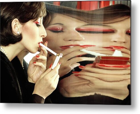Smoking Metal Print featuring the photograph Anjelica Huston Lighting A Cigarette by Bob Stone