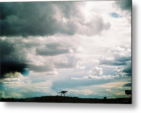 Headed West On Interstate 40 I Caught This Dinosaur In The Foreground Of Western Storm Clouds Of White Metal Print featuring the photograph Dinosaur on the Western Horizon by Belinda Lee