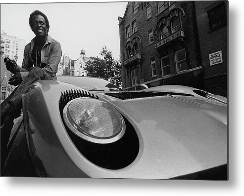 Music Metal Print featuring the photograph Jazz Musician Miles Davis Sitting On The Hood by Mark Patiky