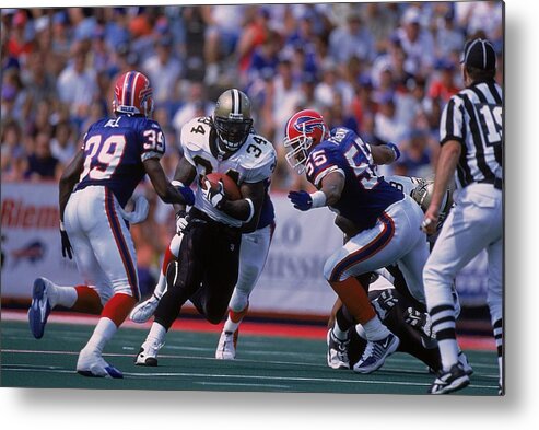 Sports Ball Metal Print featuring the photograph Ricky Williams #34, Jay Foreman #55, Raion Hill #39 by Rick Stewart