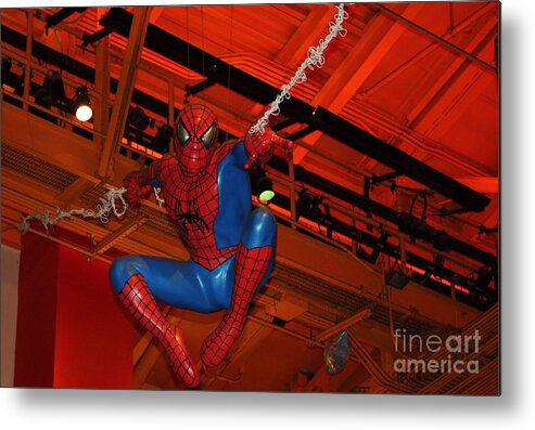 Spiderman Swinging Through The Air Metal Print featuring the photograph Spiderman Swinging Through the Air by John Telfer