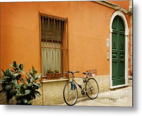 Bicycle Leaning Against Orange Building With Green Door In Italy Metal Print featuring the photograph The Green door by Jim Calarese