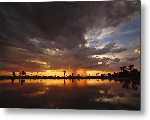 Mp Metal Print featuring the photograph Sunset And Storm Clouds Over Waterhole by Gerry Ellis