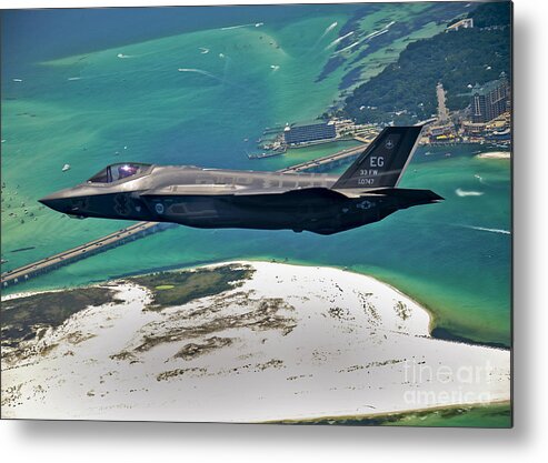 Stealth Metal Print featuring the photograph An F-35 Lightning II Flies Over Destin by Stocktrek Images