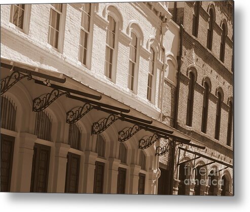 Sepia Metal Print featuring the photograph Four Corners in New Orleans by Carol Groenen