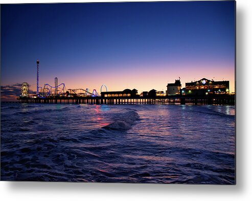 Galveston Pier At Night Metal Print featuring the photograph Galveston Pier at Night by Steven Michael