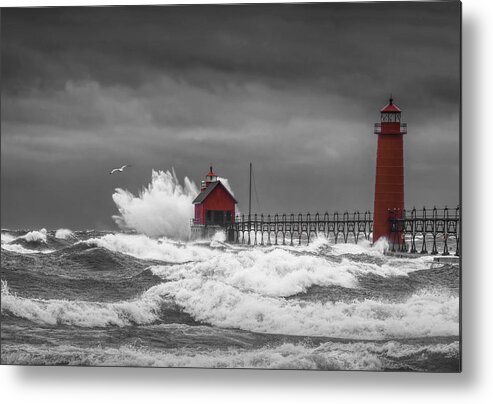 Lighthouse Metal Print featuring the photograph November Storm with Flying Gull by the Grand Haven Lighthouse by Randall Nyhof