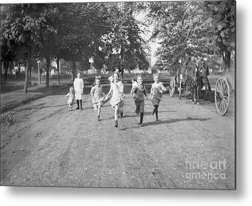 Child Metal Print featuring the photograph Children 3-12 Years Running Dirt Road by Bettmann