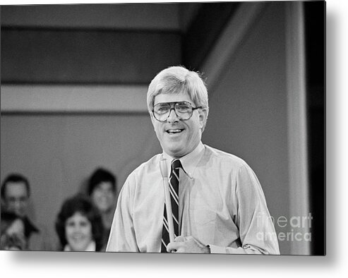 1980-1989 Metal Print featuring the photograph Phil Donahue Standing While Working by Bettmann