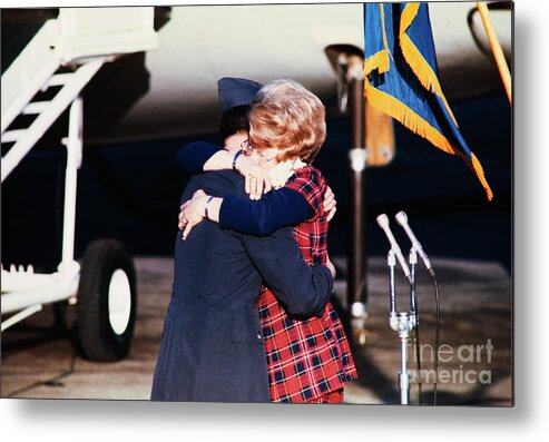 Mid Adult Women Metal Print featuring the photograph Pow Terry M. Geloneck Embracing by Bettmann