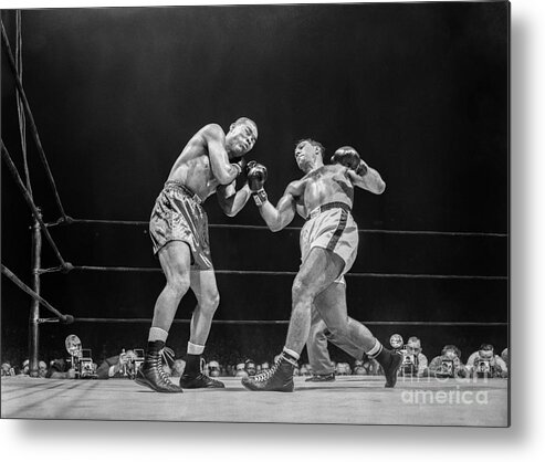 1950-1959 Metal Print featuring the photograph Rocky Marciano Vs Joe Louis by The Stanley Weston Archive