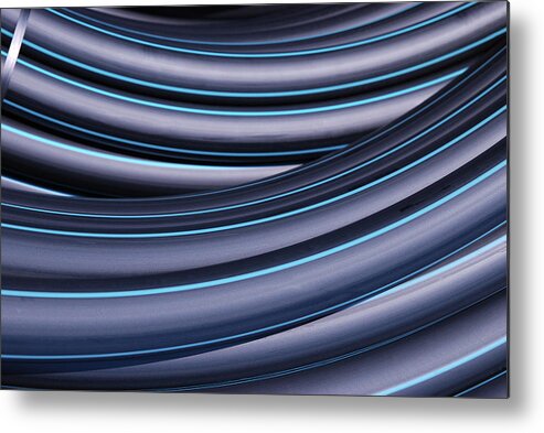 Curve Metal Print featuring the photograph Rolls Of Plastic Tube by Pixelprof