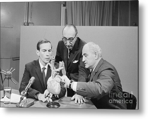 People Metal Print featuring the photograph Surgeons Discuss First Heart Transplants by Bettmann