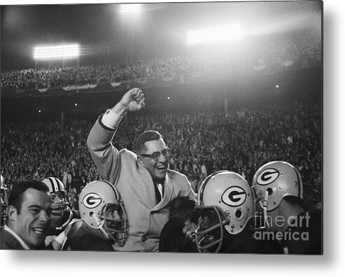 Headwear Metal Print featuring the photograph Vince Lombardi Being Carried by Bettmann