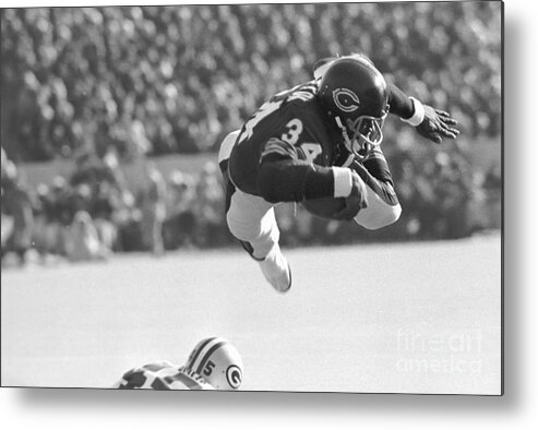 People Metal Print featuring the photograph Walter Payton In Mid-leap With Football by Bettmann