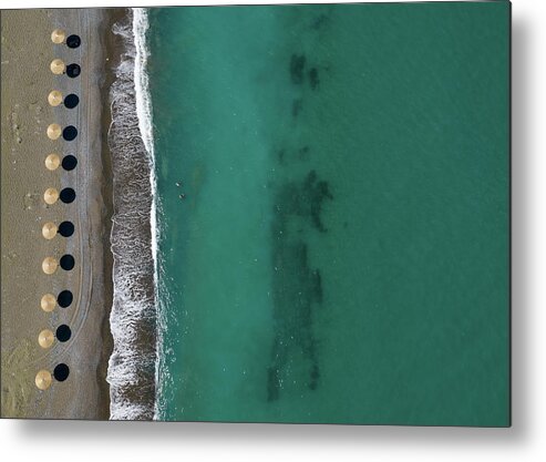 Summertime Metal Print featuring the photograph Aerial view from a flying drone of beach umbrellas in a row on an empty beach #2 by Michalakis Ppalis