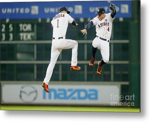 American League Baseball Metal Print featuring the photograph George Springer and Carlos Correa by Bob Levey
