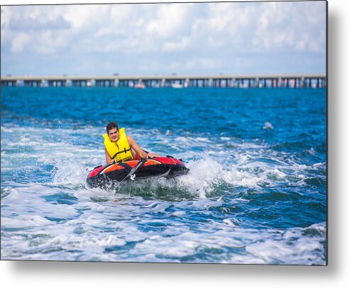 Tubing Metal Print featuring the photograph Tubing behind boat #2 by Thepalmer