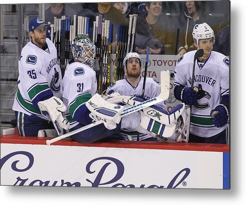 People Metal Print featuring the photograph Vancouver Canucks v Winnipeg Jets #21 by Marianne Helm