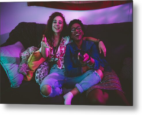 Hipster Culture Metal Print featuring the photograph Happy multi-ethnic friends having fun wathing TV together by Wundervisuals