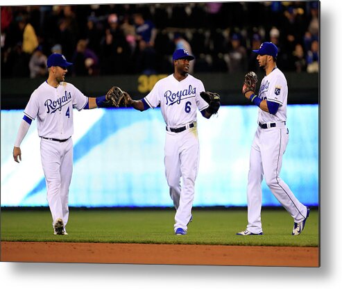 People Metal Print featuring the photograph Lorenzo Cain, Alex Gordon, and Paulo Orlando by Jamie Squire
