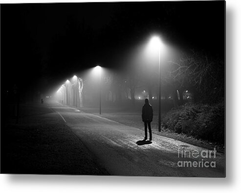 Alone Metal Print featuring the photograph Single Person Walking on Illuminated Street in the Dark Night by Andreas Berthold