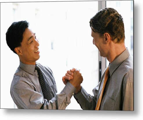 Office Metal Print featuring the photograph Two men shaking hands, side view by James Hardy