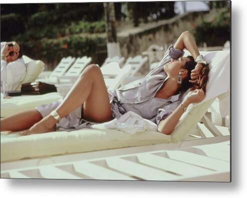 Accessories Metal Print featuring the photograph Yasmin Le Bon Lounging on a Beach by Arthur Elgort