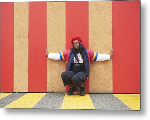 Youth Culture Metal Print featuring the photograph Young woman crouching with arms outstretched. by We Are