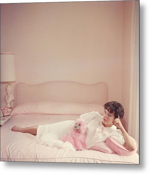 People Metal Print featuring the photograph Joan Collins Relaxes by Slim Aarons